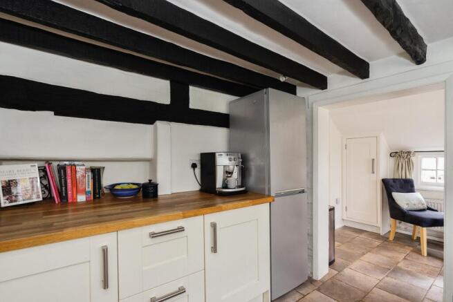 Kitchen opens to breakfast area
