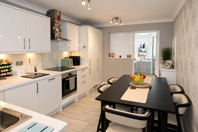 Modern Galley Kitchen and Dining Space.png