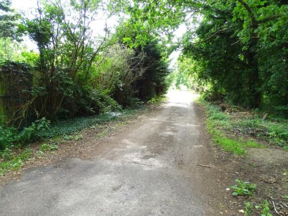 SERVICE ROAD TO REAR