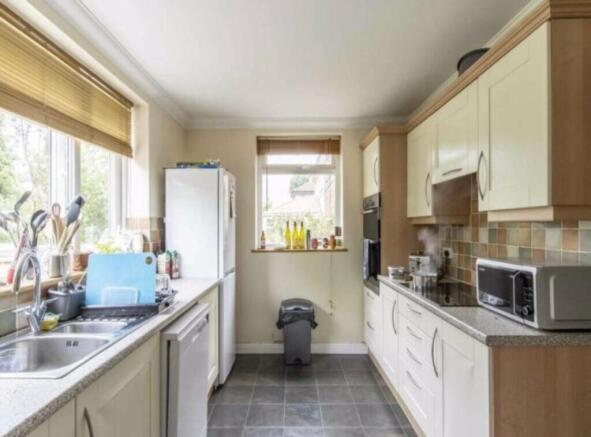 A bright and functional kitchen equipped with m...