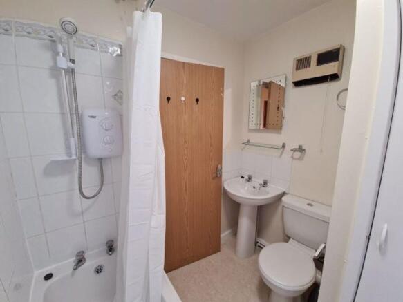 Clean, well-maintained bathroom with a shower-b...