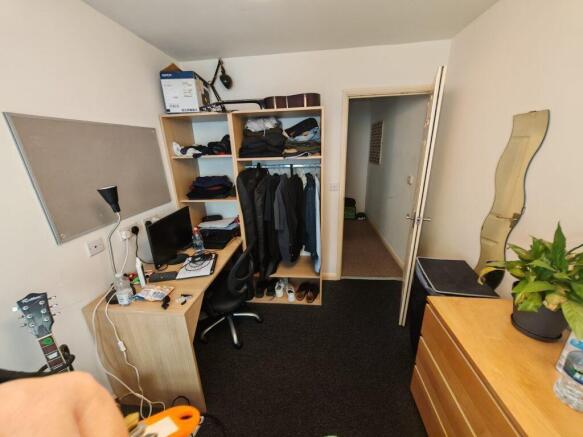 Bright bedroom with ample study and storage spa...