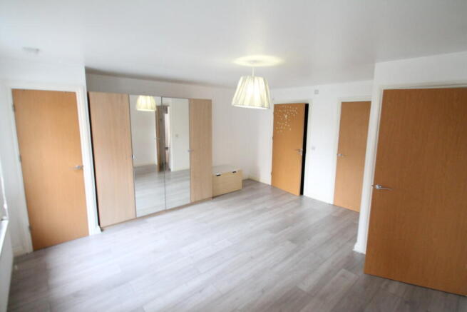 egnormous bedroom, lots of built in storage , wood floors , dual access to bathroom via hall and bedroom .