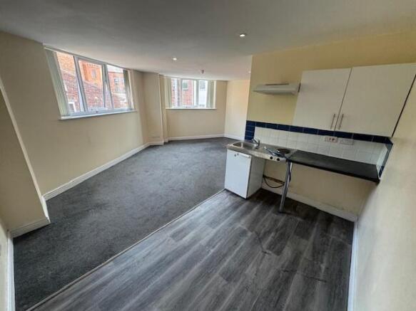 Bright open-plan studio room with bay windows, ...