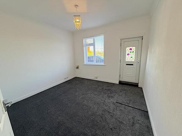 Freshly carpeted room with bright natural light...
