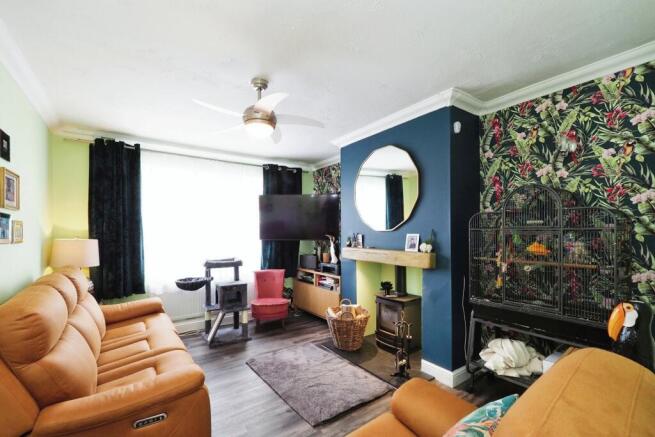 Tastefully decorated lounge with cosy log burner