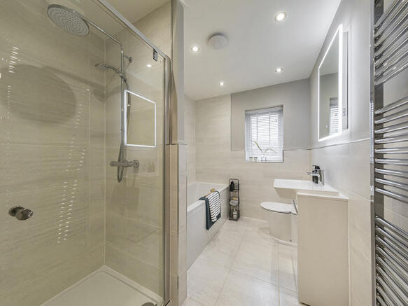 Family bathroom with separate shower 
