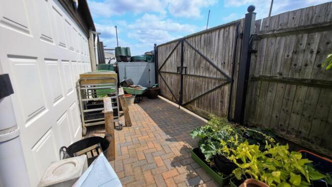 Behind garage