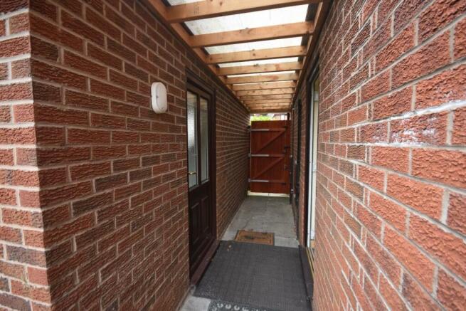 SHELTERED AREA FROM KITCHEN TO GARAGE CONVERSION