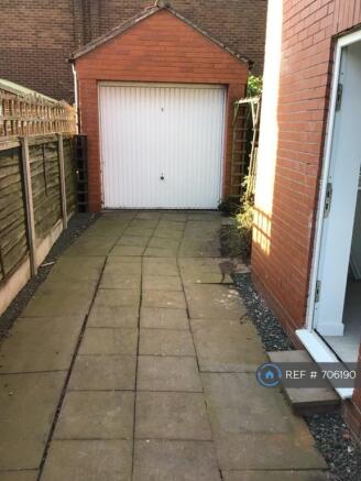 Drive ,Showing The Side /Back Door And Garage