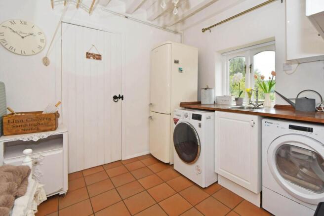 Utility room leading to WC