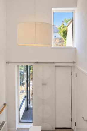 Double height entrance landing located midway betw