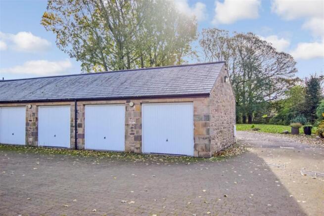 The garage is the 2nd from the right