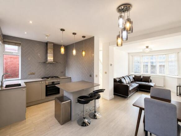 Modern open-plan kitchen with breakfast bar...
