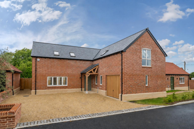 AI image of plot 8 with garage doors.png