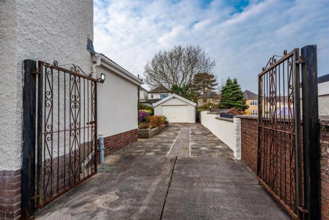 View of rear garage/driveway