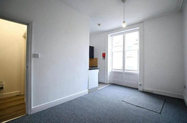 Bright and airy room with large window...