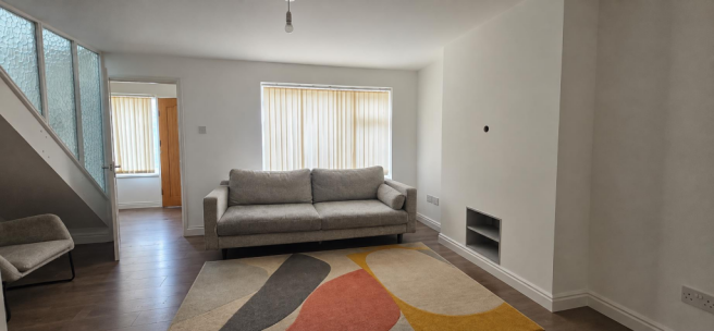 Minimalist Living Room with Abstract Rug.png