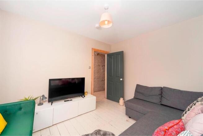 Cozy living room with TV and comfortable sofa....