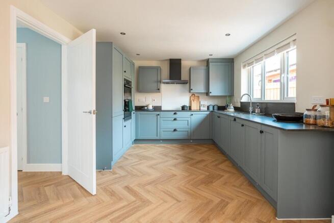 Upgrade to Silestone worktops and integrated appliances for a sleek, modern kitchen.