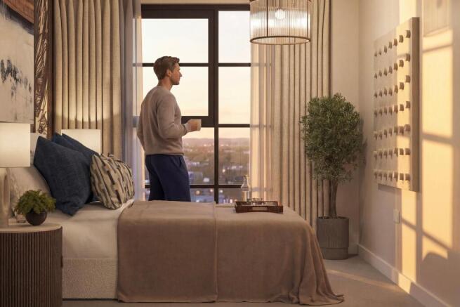 Man looking out of bedroom window