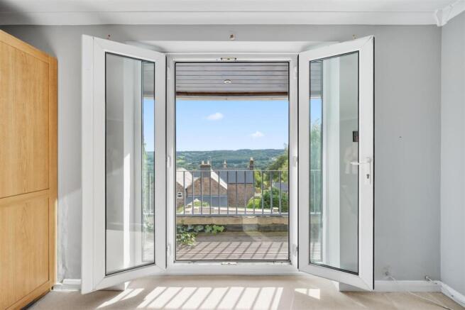 Bedroom One - balcony doors open.jpg