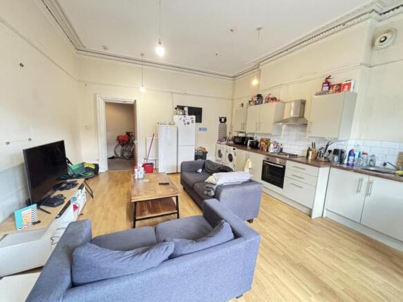 A spacious and well-lit contemporary living roo...