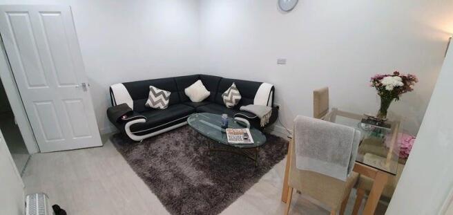 Modern lounge with corner sofa and dining area...