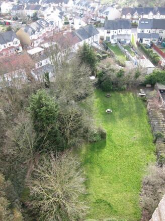 View of the gardens, play area and barbecue