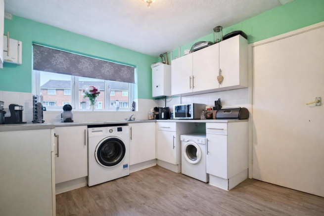Bright kitchen with mint green accents.png