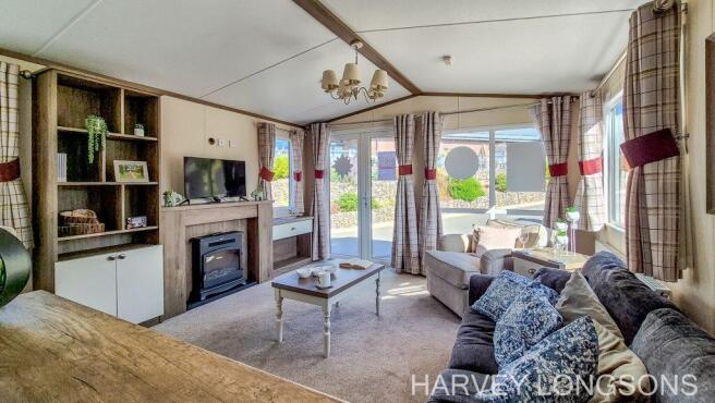 Bright lounge with patio doors and seating.
