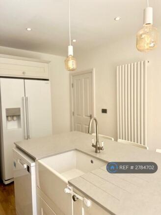 Belfast Sink With American Fridge Freezer .