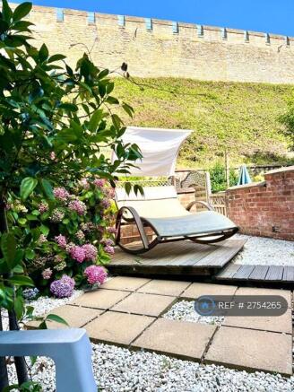 Sunny Garden With Interesting Furniture 