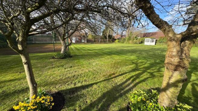 Back garden and tennis court