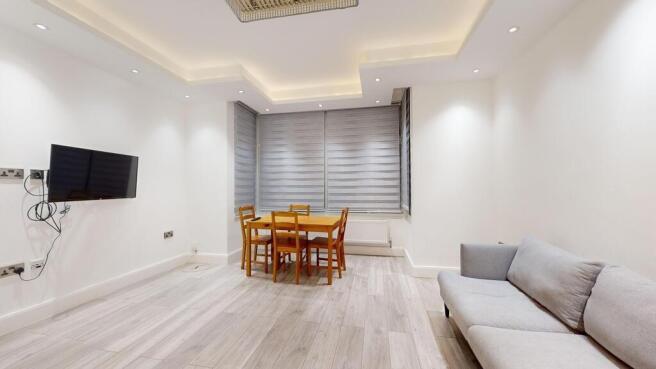 Bright modern living/dining area with sofa...