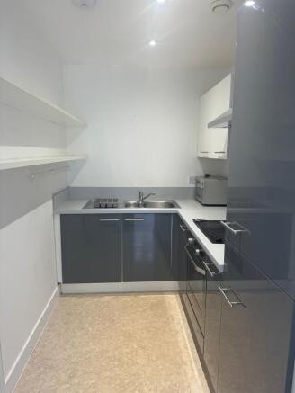 Modern fitted kitchen with sleek cabinets...