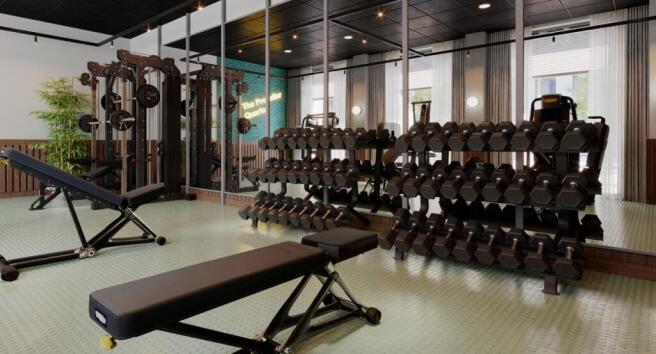 Modern, well-equipped gym with mirrored wall, r...