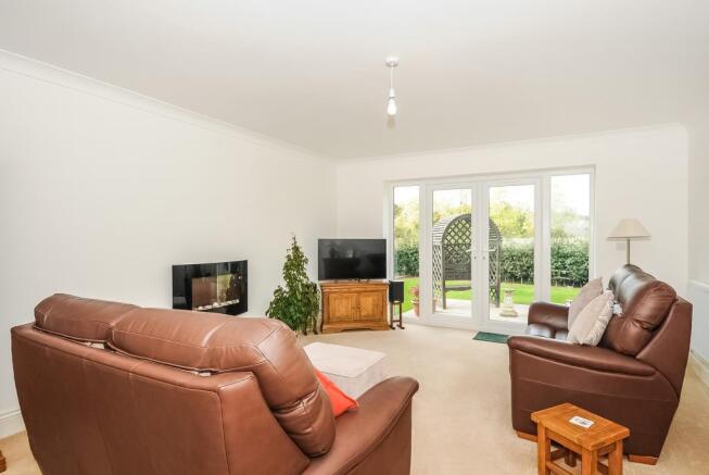 Spacious sitting room overlooking the garden