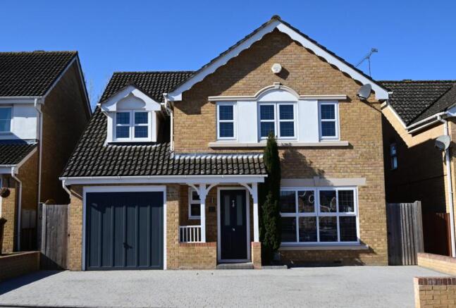 Outside View Of The Property With Driveway Parking