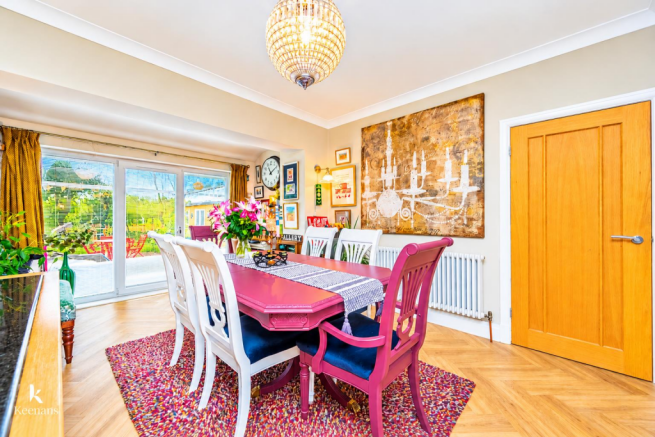 Vivid Magenta Dining Room with Gallery Wall.png
