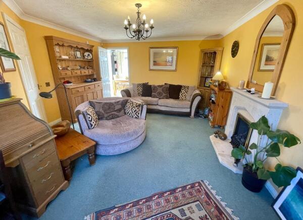 Large sitting room c/w stone fireplace