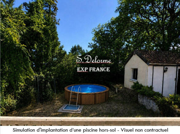 Vue de la porte fenêtre de la cuisine sur le jardi