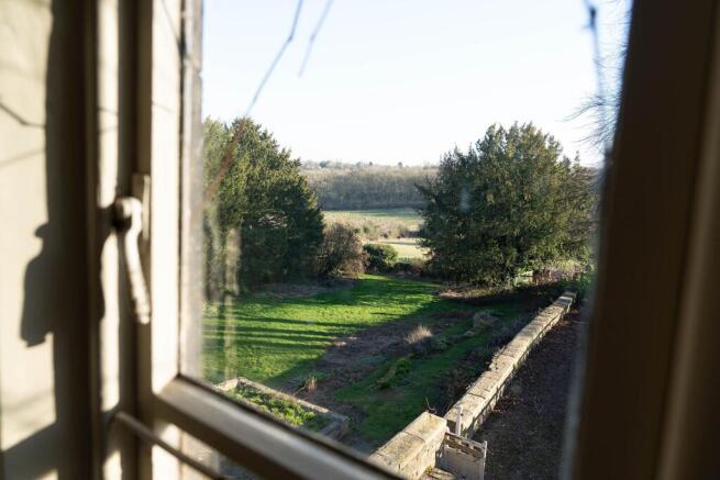 Views over the tiered garden and fields beyond