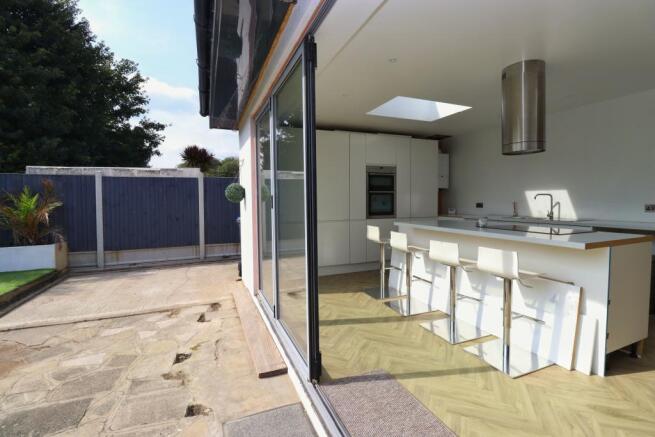 Kitchen with open Bifold Doors 