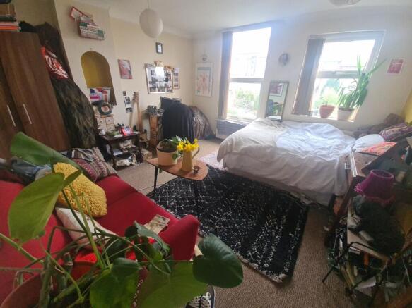 Bright and inviting master bedroom featuring a ...