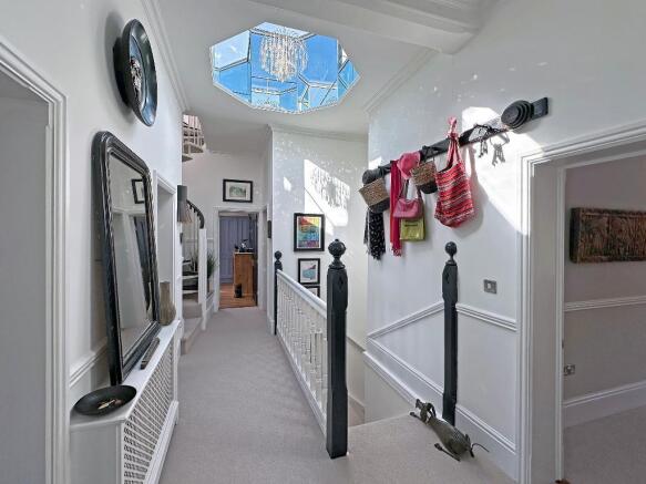 Sunlight floods the atrium/landing