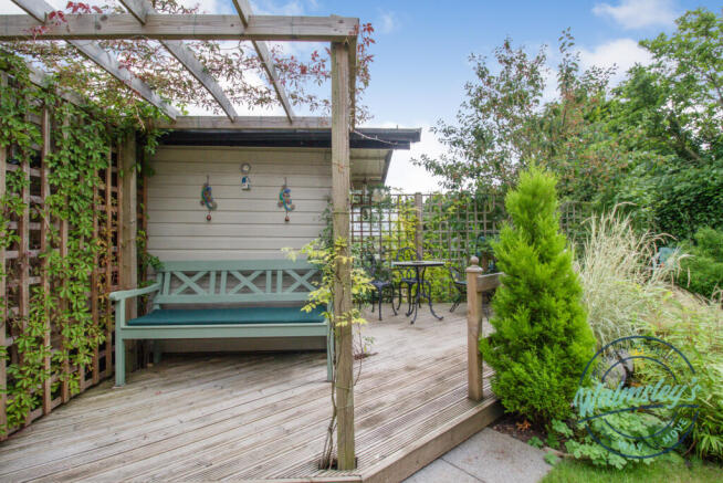 Decked sitting area and Summer house