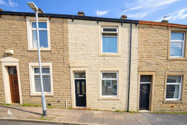Terraced houses under a blue sky.png