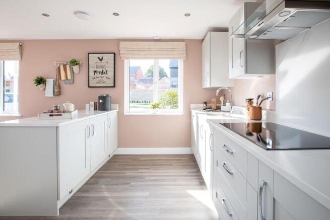 The spacious kitchen with ample work space makes family meal prep easy