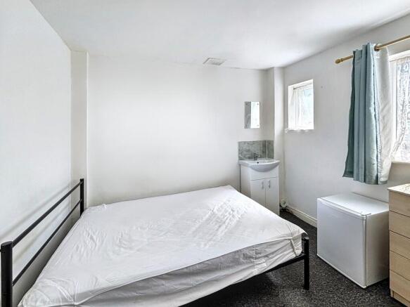 Bright double bedroom with private vanity sink...
